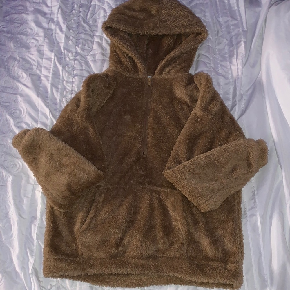 slightly worn brown hoodie/sweater.
